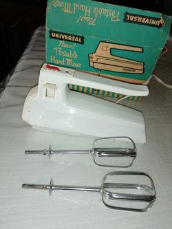Like new Universal portable hand mixer whips blend mixes beats and mashes model number 6246