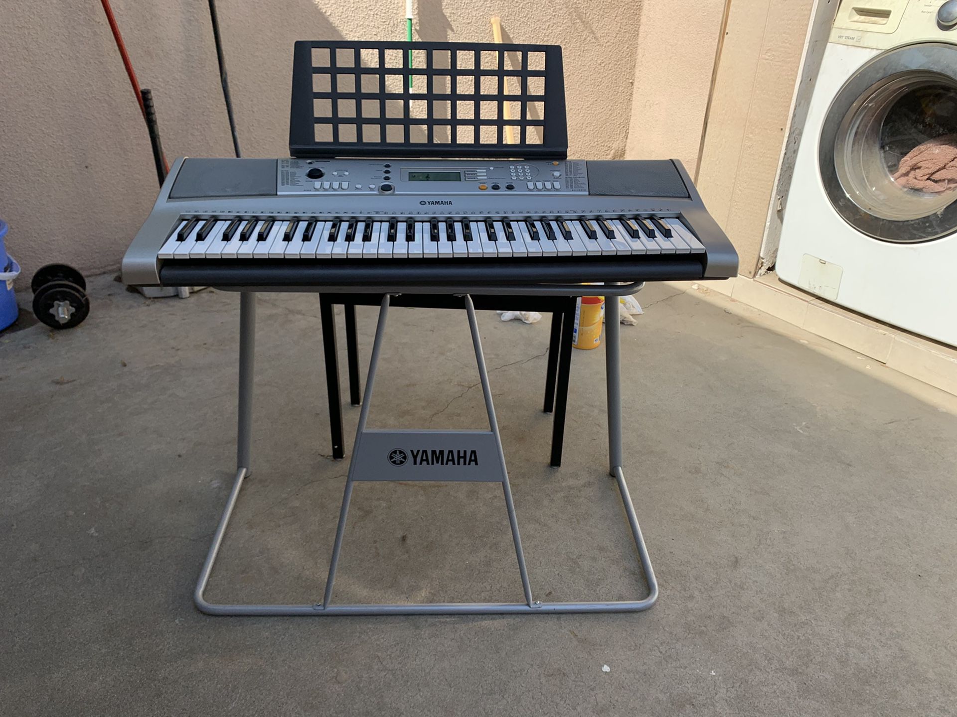 Yamaha electric piano with stand and steat