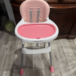 Pink booster chair
