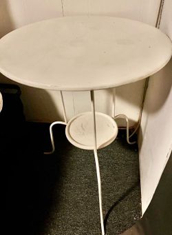Round white metal side table