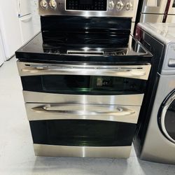 GE electric stove, stainless steel, includes a receipt with a 60-day warranty.