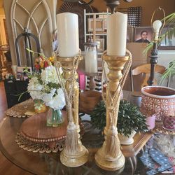Gold candle holders with tassels