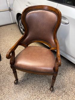 Brown leather and wood chairs