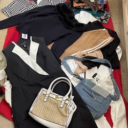 Lot of small-sized clothing. Dresses, pants, shirts, and a handbag. Excellent condition. Desert Inn and Decatur.