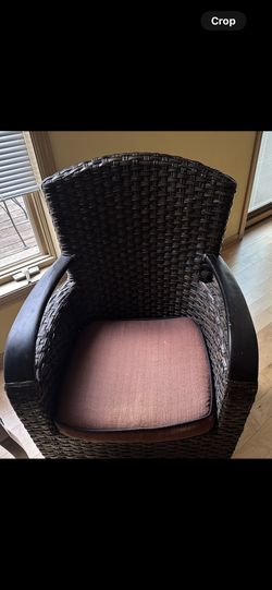 2 Brown Wicker Chairs With Small Iron Rod Table