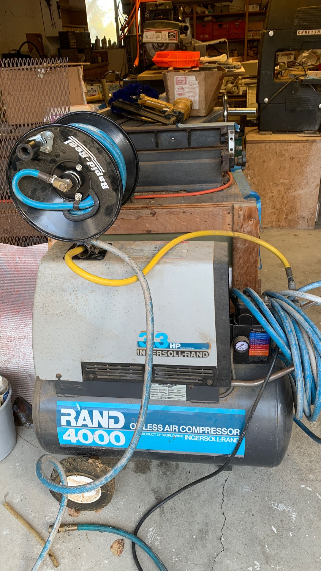 Air compressor with additional reel