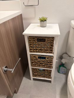 storage cabinet with woven basket