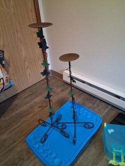 Two rustic metal pillar candle holders