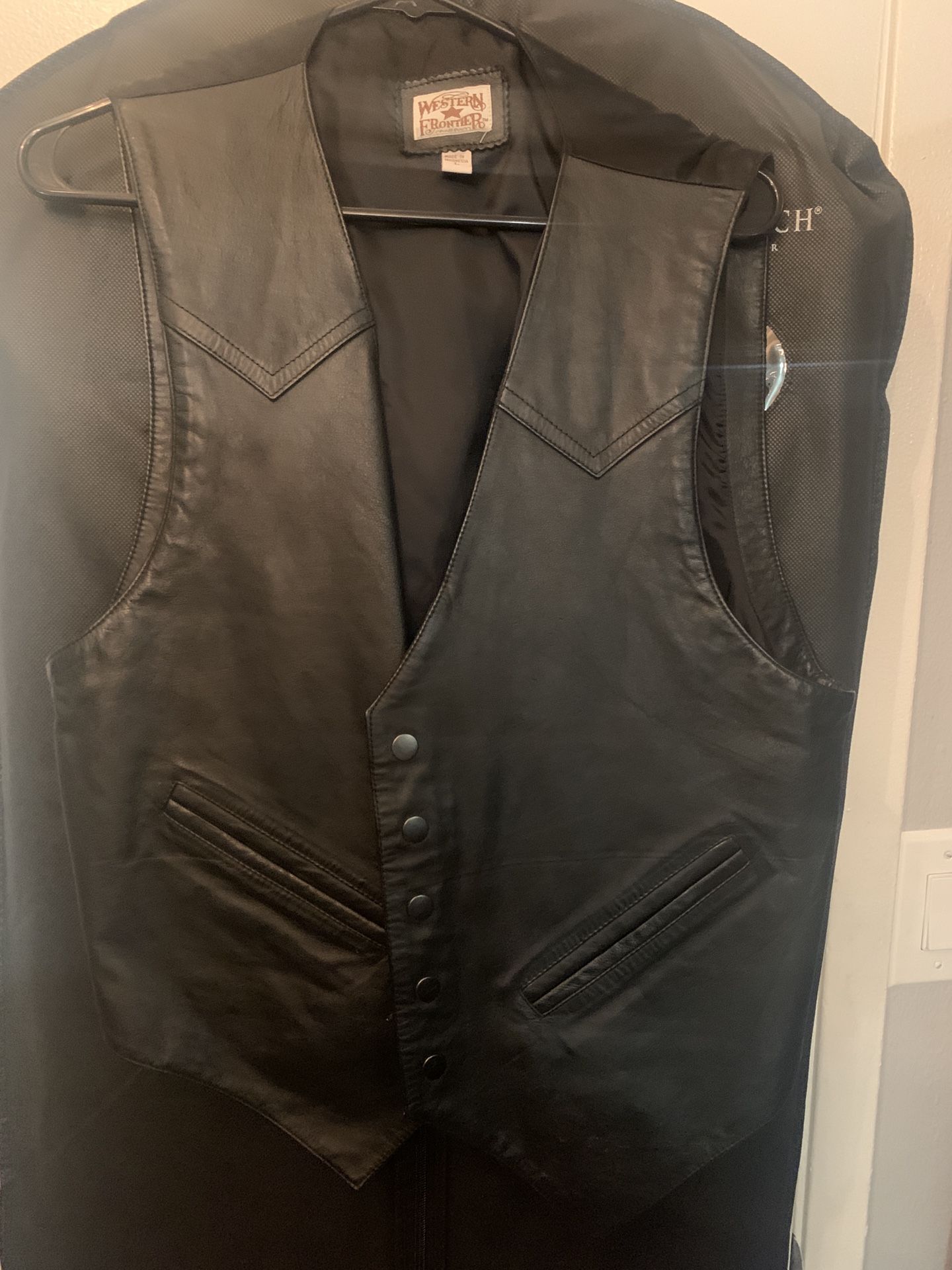 Black leather vest, size large. never been worn.