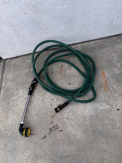Used 25 feet garden hose with sprayer