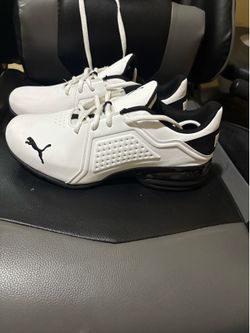 Black and white original used Puma size :Us 7.50