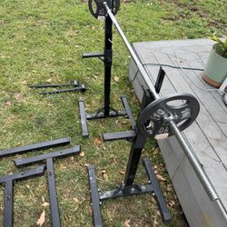 Square rack, two 10lbs standard plates and one standard weighted barbell.