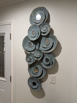sculptural metal wall mirror