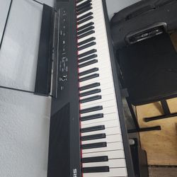 Alesis piano with chair 