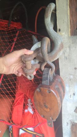 Antique cast iron hooks and block