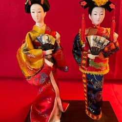 A pair of Japanese and Chinese Dolls