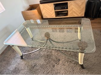 Elegant Glass Top Coffee Table with Faux Tusk-Style Base – $75 OBO