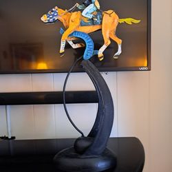 18 1/2 in tall horse jockey figurine that gallops when you push it (like a pendulum).