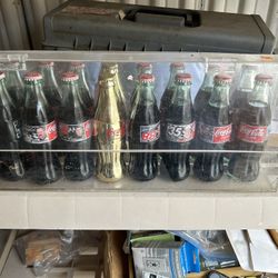 Collectible Coke bottles In Case