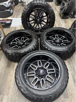 22x12 Gloss Black Milled Wheels 8x170 + 35x12.50R22 Toyo M/T