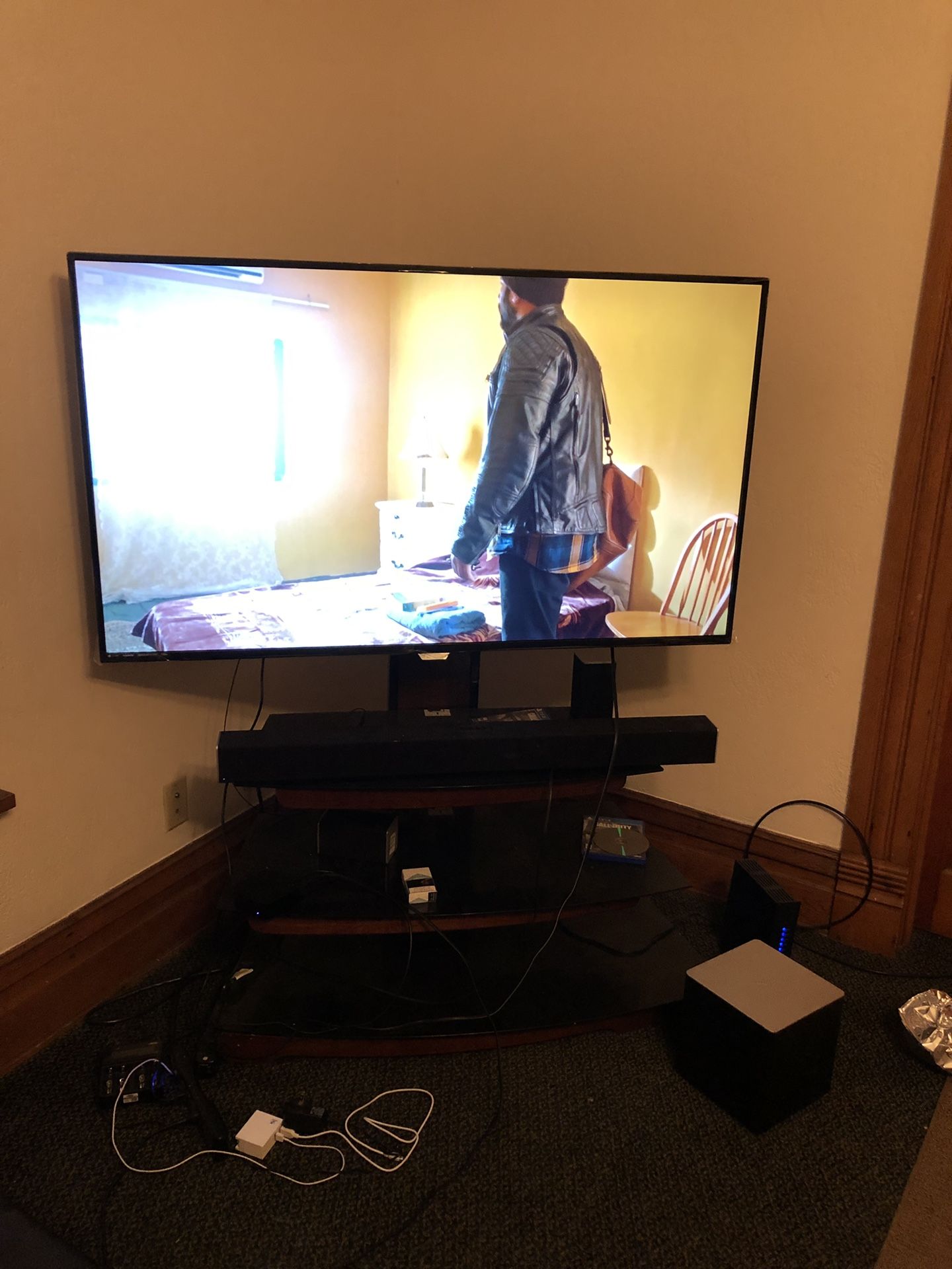 55 inch Philips Smart TV with VIZIO sound bar system and a TV Stand