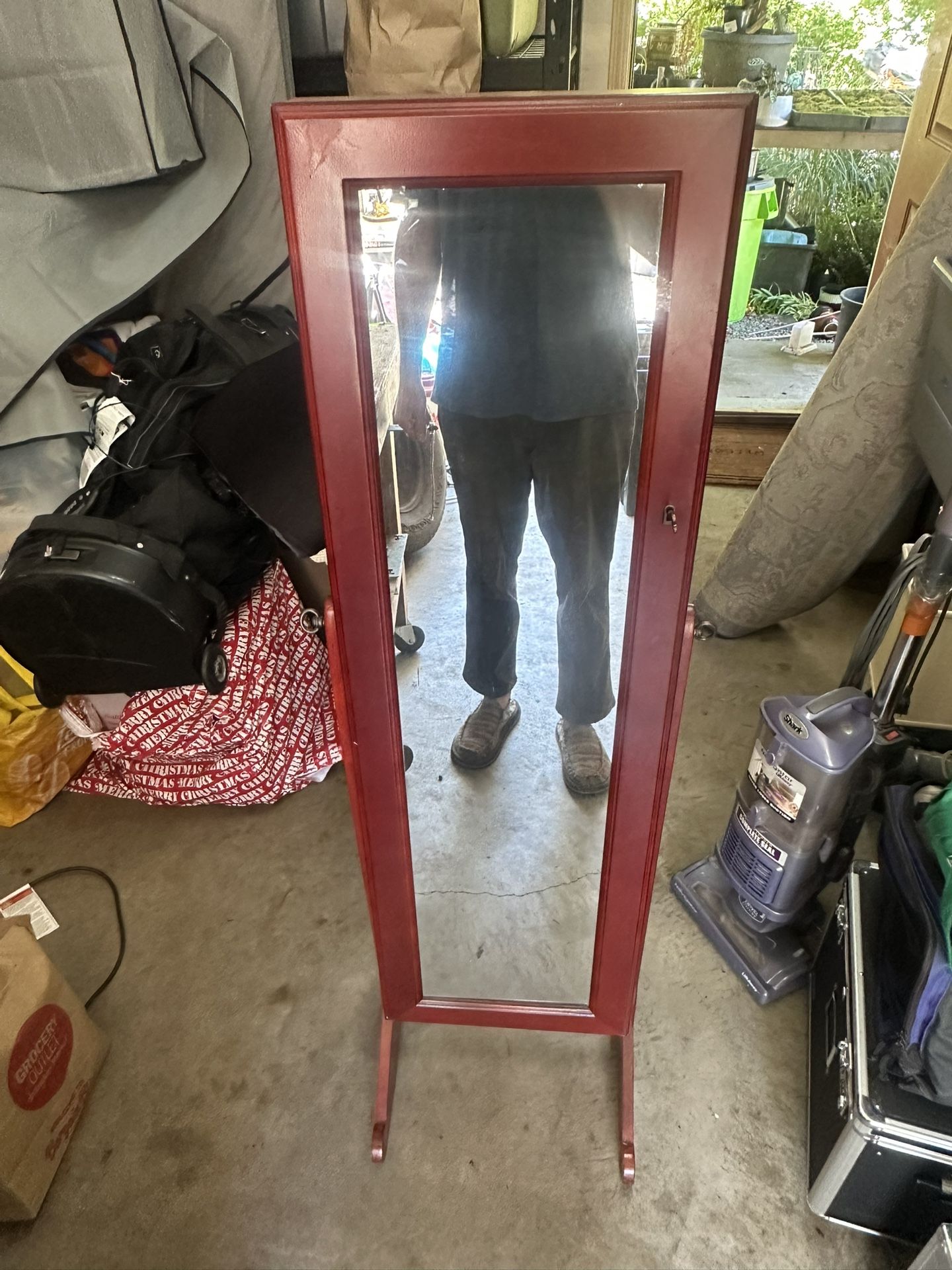 Mirror w/ jewelry storage cabinet.