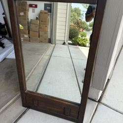 Old solid wood heavy hanging mirror in great condition!