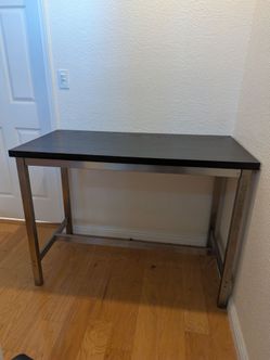 Tall bar table with one chair