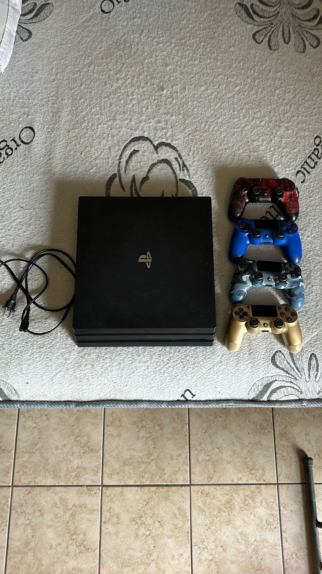 PS4 PRO w/ GAMES & CONTROLLERS