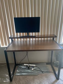 Desk monitor not included