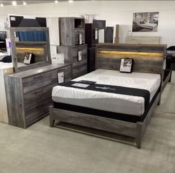 Baystorm Queen Panel Bed with Mirrored Dresser and Nightstand Set