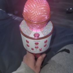 pink and white rhinestone Bluetooth karaoke microphone. 