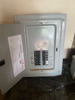 Electrical sub panel with breakers and junction box.