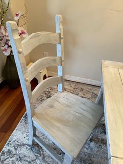 Distressed dinning room table with six chairs.
