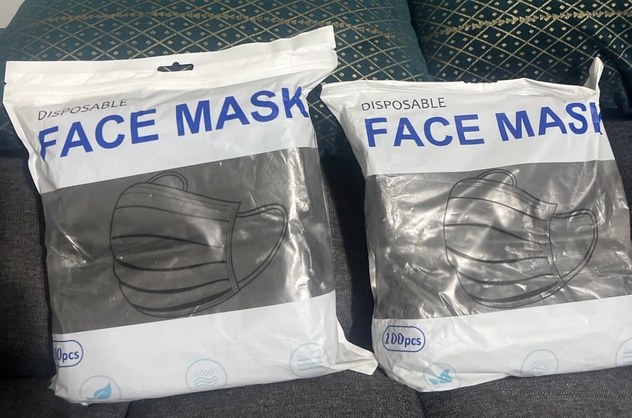 2 packs of disposable face masks each pack have 100pcs