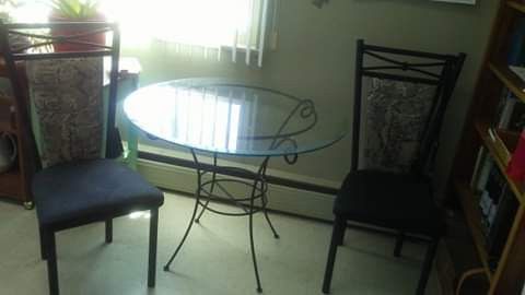 Glass dining table with 3 chairs. Large metal desk.