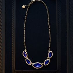Elegant Gold Necklace with Deep Blue Gemstones and Diamond Accents