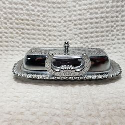 VTG Irvinware stainless steel butter dish with glass insert and butter knife . Measures 8" L X 4 3/4" W X  2" H . Good condition and smoke free home. 