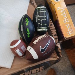 A Collection Of 4 Footballs Sell As 1 Piece