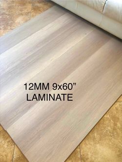 SUPER DUTY 12 MM MOISTURE RESISTANT LAMINATE FLOORING IN EXTRA WIDE 9”x60” PLANK AND PRICED TO MOVE!