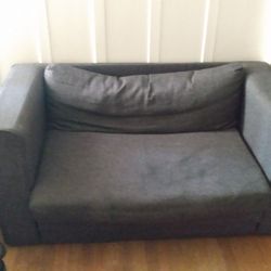 Sofa turns into a bed color charcoal grey good condition