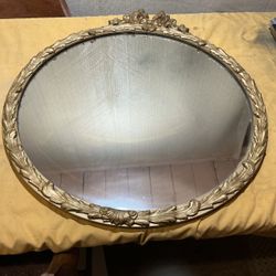 oval gilt Rococo / Baroque Revival-style wall mirror, mid-20th century,