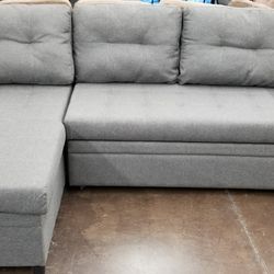 Small reversible sofa chaise sectional with a pullout bed