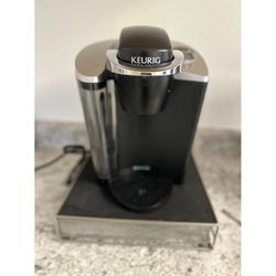 Keurig k50 coffee maker and pod sorter rack