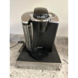 Keurig k50 coffee maker and pod sorter rack