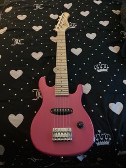 Mini pink electric guitar