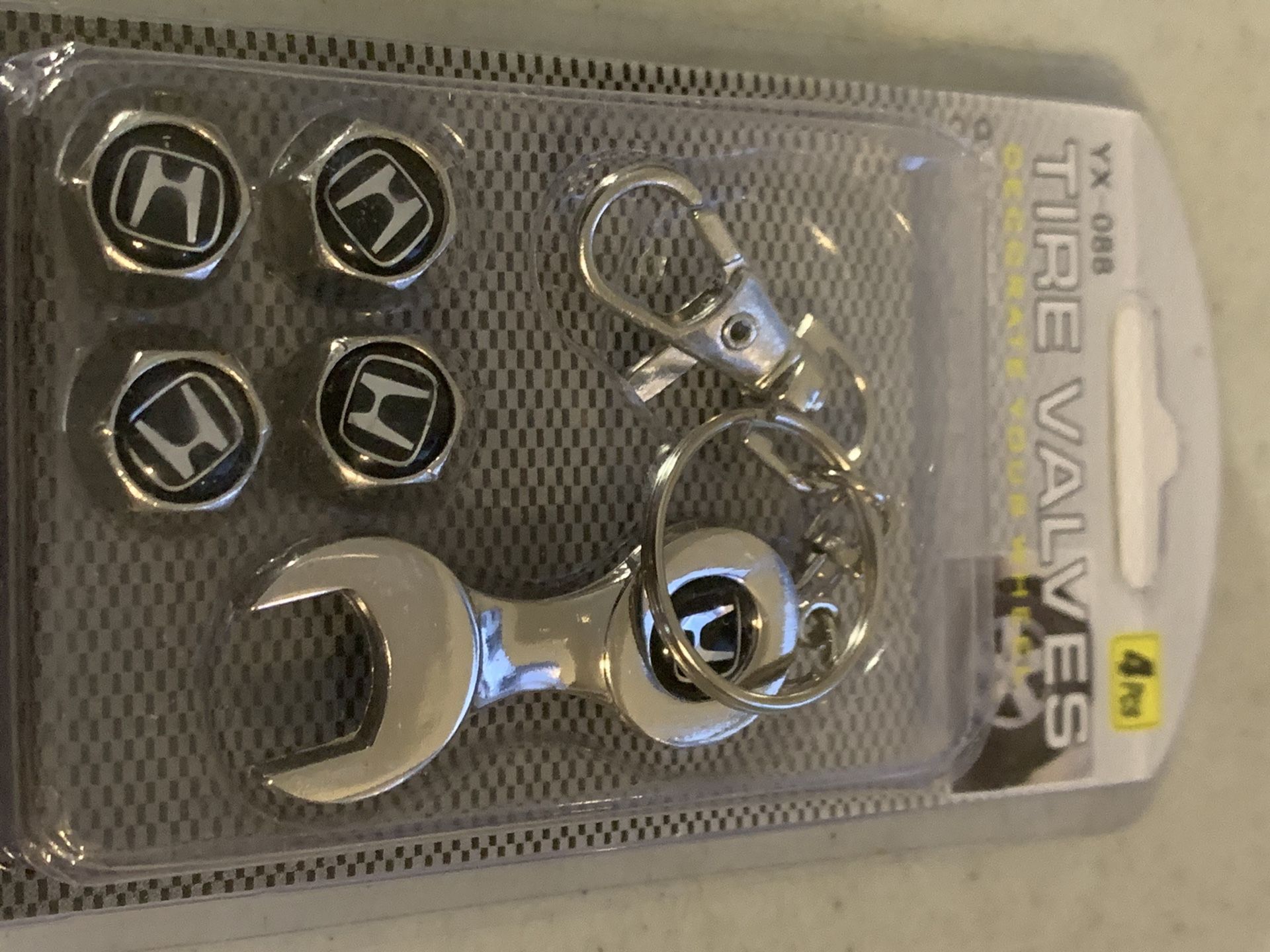 Honda tire air valve covers with keychain wrench