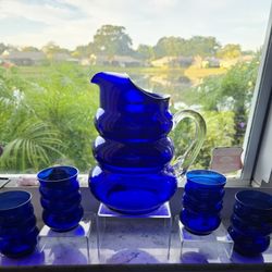 Vintage Louie Glass Harpo cobalt blue depression glass pitcher and tumblers set. 

