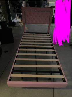 pink upholstered twin bed frame featuring a rectangular, crystal-tufted headboard