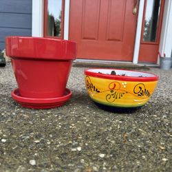 Two brightly colored ceramic flower pots 